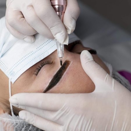 caucasian-woman-going-through-microblading-treatment